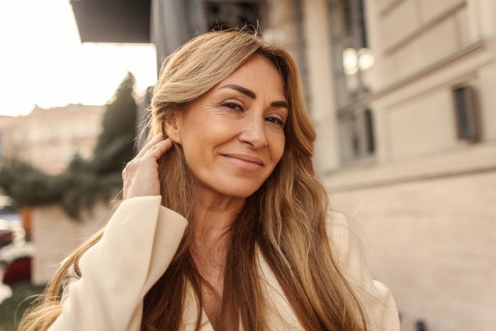Closeup of smiling fairskinned adult woman