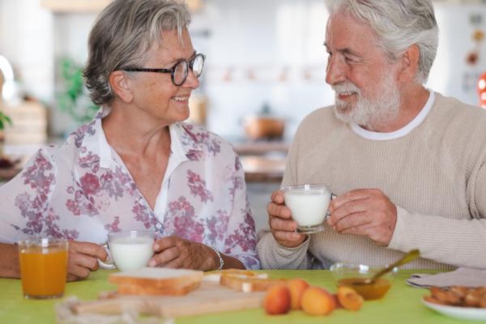 Beautiful senior couple having breakfast