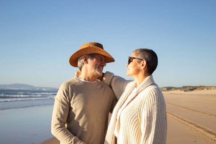Lovely senior couple standing at seashore