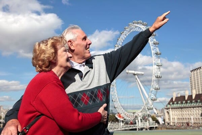 Retired couple in london with millenium wheel