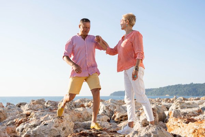 senior couple holding hands