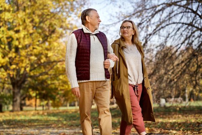 mature couple walking tree lined neighborhood Chevy Chase Maryland