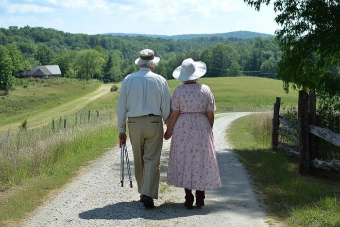 mature couple walking scenic country road Southern New Hampshire
