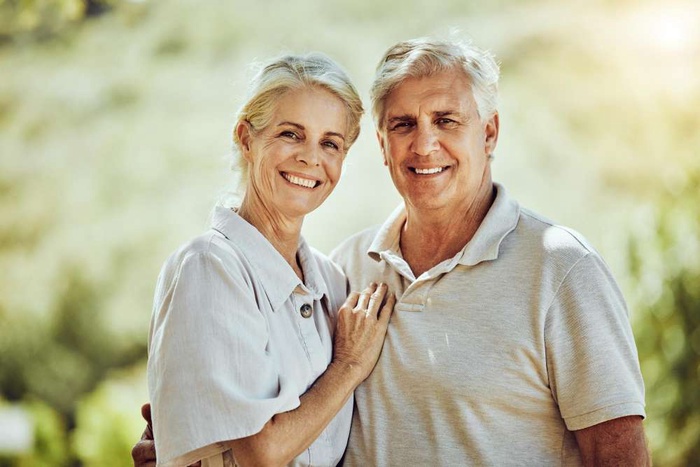 Love portrait or happy old couple in nature or park bonding or hugging in a happy marriage partnership Retirement 