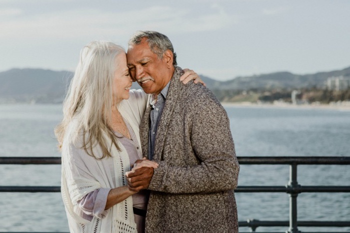  Cheerful senior couple dancing on santa monica pier