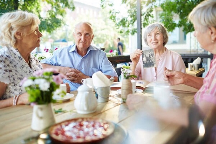 Elderly woman sharing story of her family
