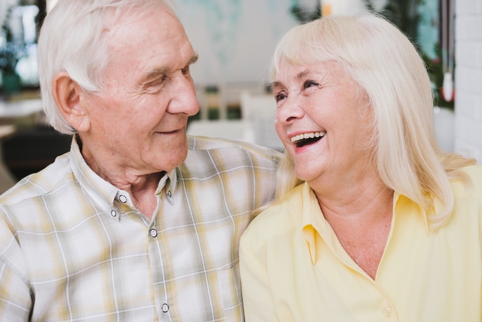 Smiling mature couple at home