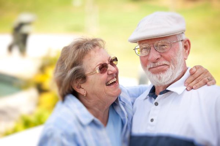 happy senior couple park