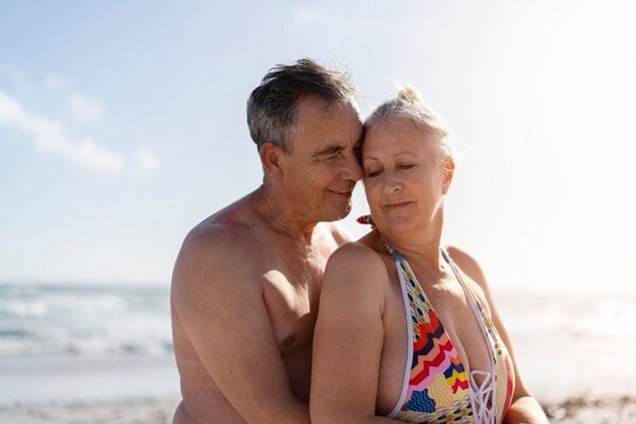 Side view romantic old people at beach