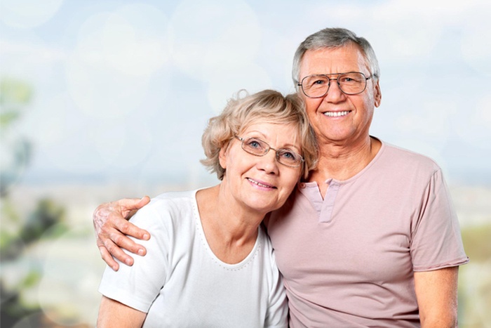 Portrait of happy senior couple smiling