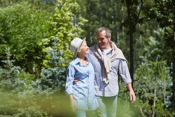 Senior Couple Walking in Woods