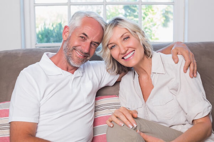 Portrait of a relaxed mature couple sitting on sofa