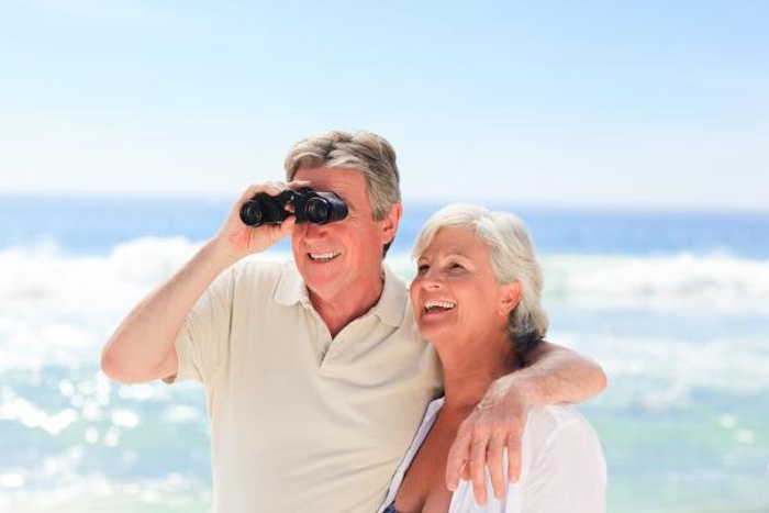 Senior couple watching rocket launch together on Florida Space Coast Brevard County