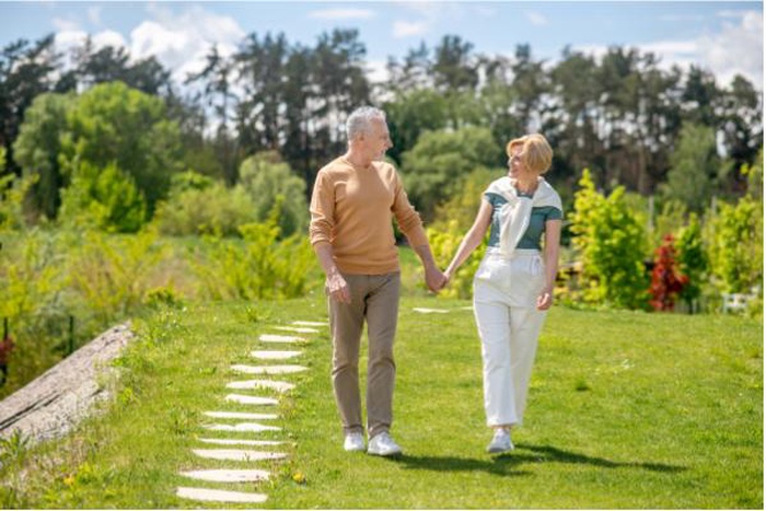 Loving married couple strolling in the countryside