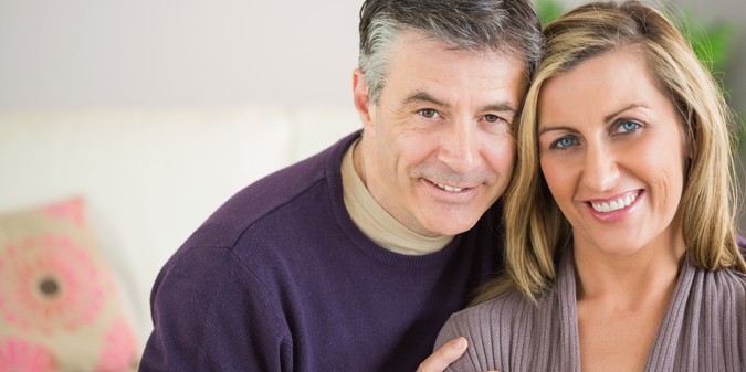 Happy couple looking at camera