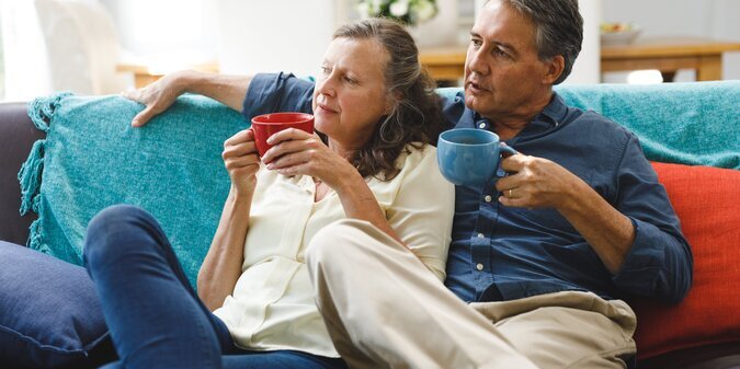 Happy senior caucasian couple in living room