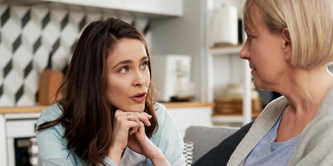 Widowed mother talking with adult children