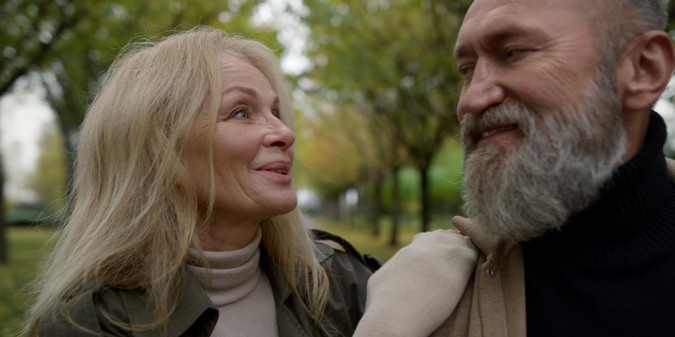 Portrait of cheerful married couple having fun outdoors