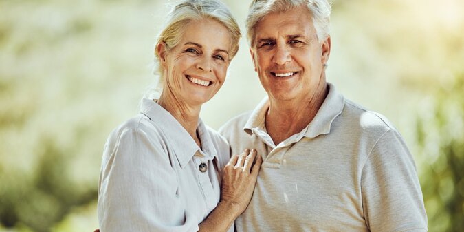 Happy old couple in nature