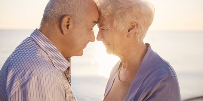 Senior couple standing face to face