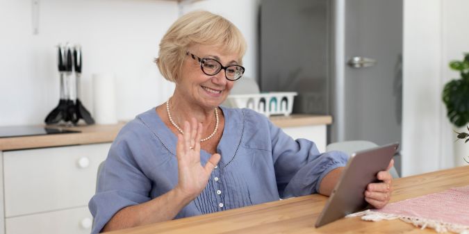 An older woman is making a video call