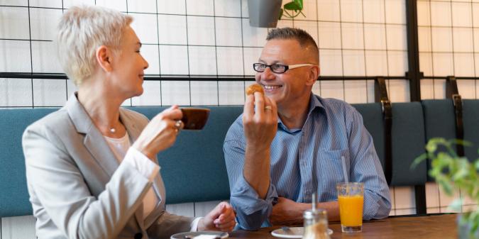 Senior couple enjoying coffee on a first date