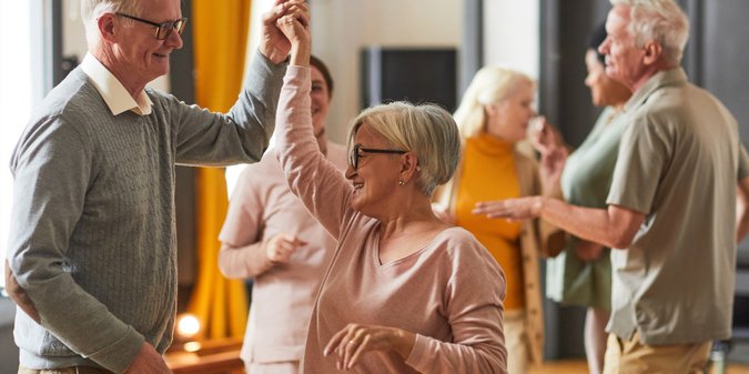 Senior People Dancing in Retirement Home
