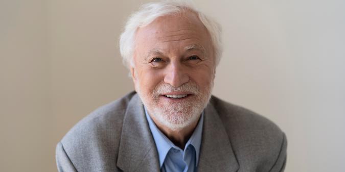 Smiling mature man portrait indoors