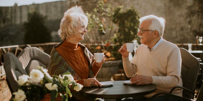 Senior couple drinking coffee in the outdoor