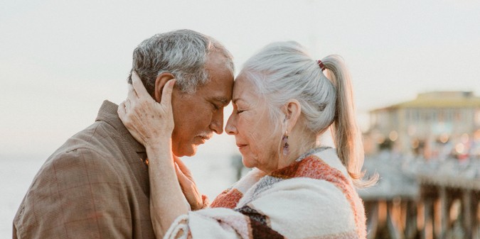 Romantic senior couple by the pier