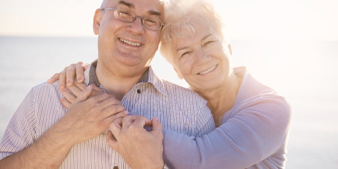 Portrait of seniors in love on the beach