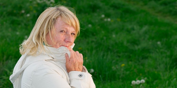 Portrait of woman standing on field