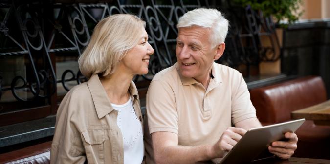 Senior man and woman smiling on dating profile