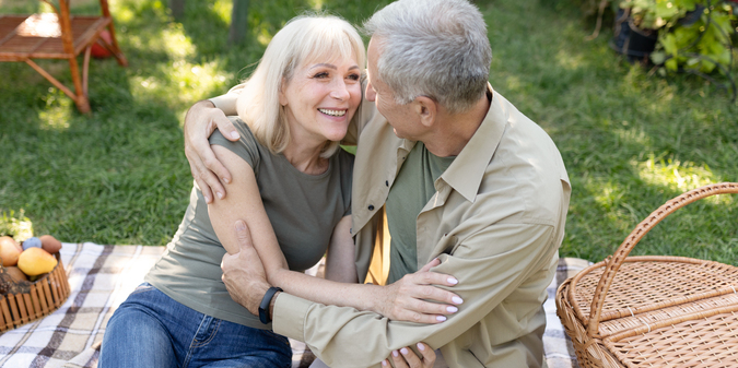 excited-senior-spouses-having-picnic