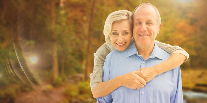 happy mature couple embracing smiling