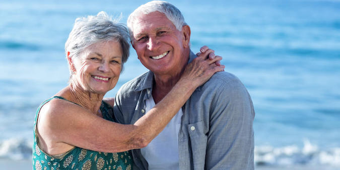 Senior couple embracing at the beach