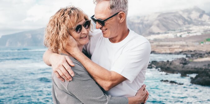 Carefree bonding senior couple embrace