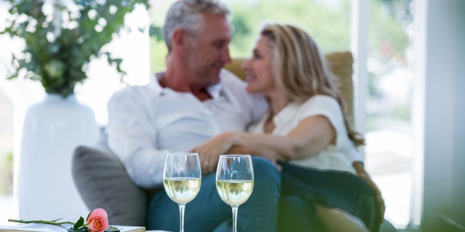 Romantic couple sitting on armchair