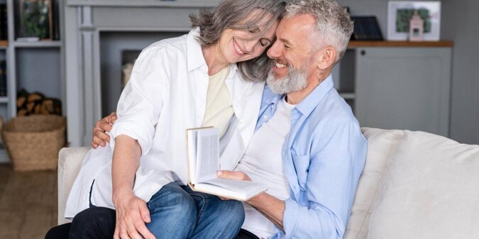 senior couple with book