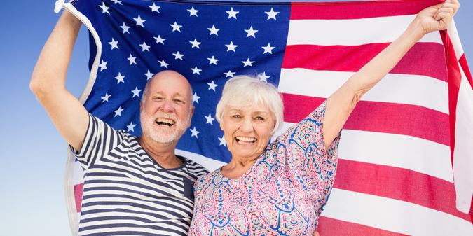 Senior couple holding American flag by @wavebreakmedia_micro 19 Mar 2