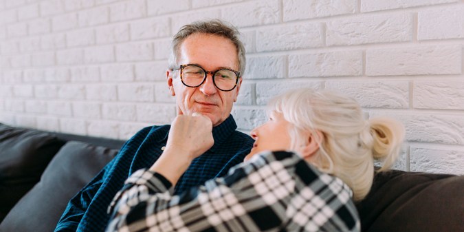 Older couple sitting in retirement home