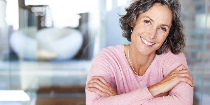smiling mature woman looking away