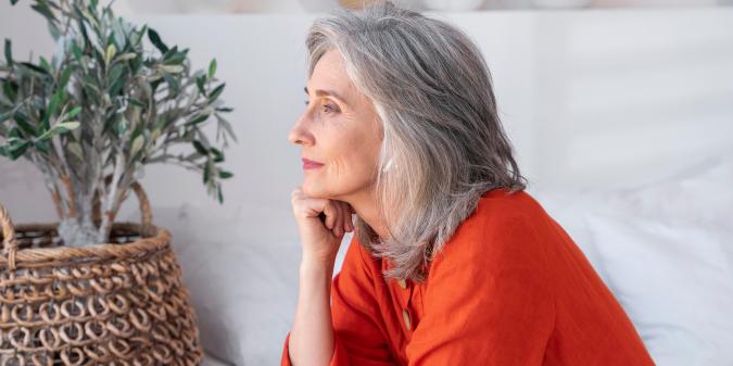 Widowed woman reflecting on new beginnings