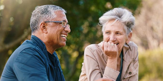 Senior couple of different faiths smiling together