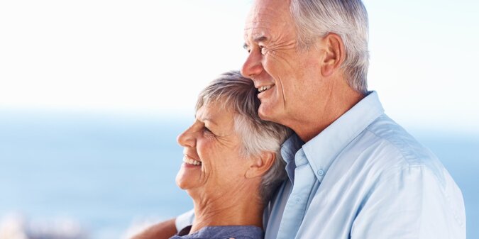 Smile mature couple and hug with blue sky