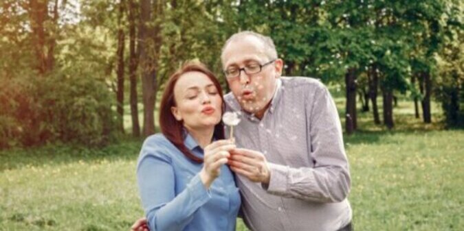 Beautiful adult couple in a summer forest