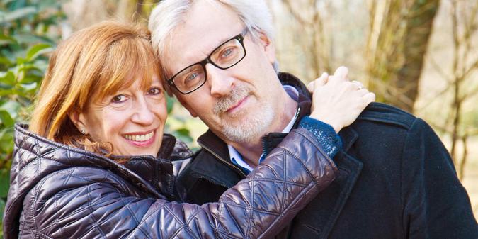 smiling couple standing outdoors
