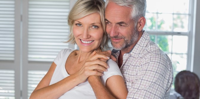 Mature man embracing a happy woman