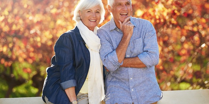 Senior couple hug in garden